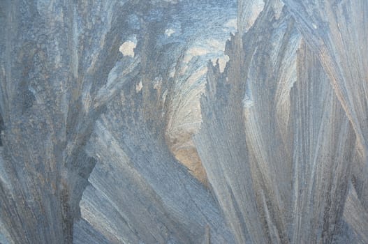 Abstract pattern on a window glass made by frost