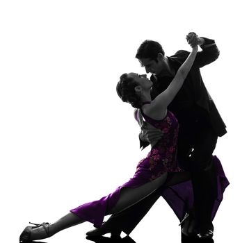 one caucasian couple man woman ballroom dancers tangoing in silhouette studio isolated on white background