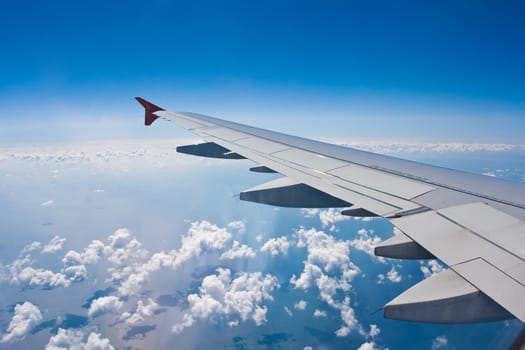 Beautiful view of  airplane wing on blue sky background