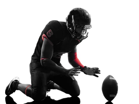 one american football player touchdown celebration in silhouette shadow on white background