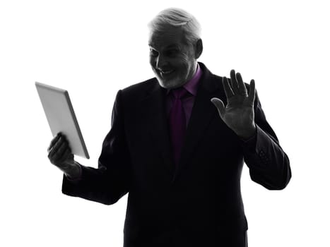 One Caucasian Senior Business Man holding digital tablet saluting Silhouette White Background