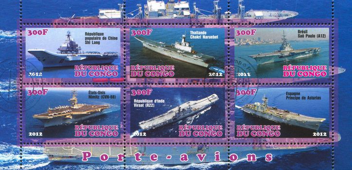 CONGO - CIRCA 2012: stamp printed by Congo, shows aircraft carrier, circa 2012
