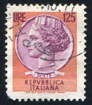 ITALY - CIRCA 1977: stamp printed by Italy, shows head of a woman, who symbolize Italy after Syracusean Coin, circa 1977