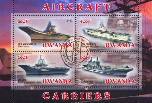 RWANDA - CIRCA 2012: stamp printed by Rwanda, shows aircraft carrier, circa 2012