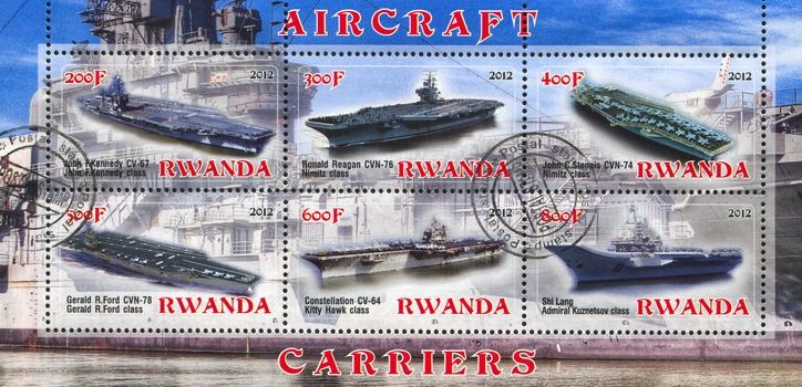 RWANDA - CIRCA 2012: stamp printed by Rwanda, shows aircraft carrier, circa 2012