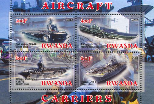 RWANDA - CIRCA 2012: stamp printed by Rwanda, shows aircraft carrier, circa 2012