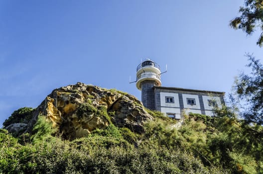 Looking at the lighthouse close to Getaria city in Spain. Beautiful environment and architecture.