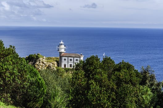 Looking at the lighthouse close to Getaria city in Spain. Beautiful environment and architecture.