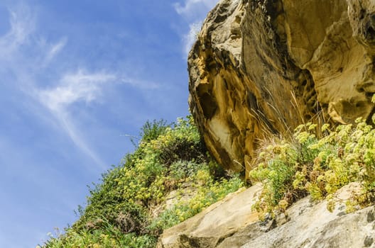 Beautiful yellow rock close to the Atlantic ocean.