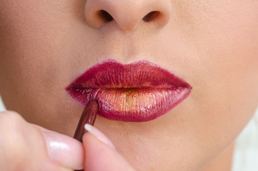 Closeup on Woman Face with Fashion Red Lips Makeup. Apply Bloody Red Lipstick.  Natural photo.