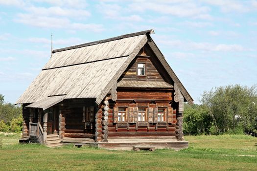 Old wooden house in a field