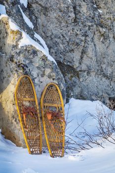 vintage wooden Bear Paw snowshoes in Colorado winter landscape
