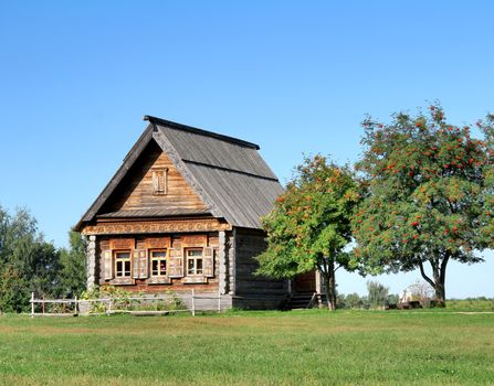 Old wooden house in a field