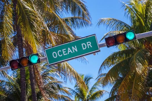 street sign of famous street Ocean Drive in Miami South with traffic light 