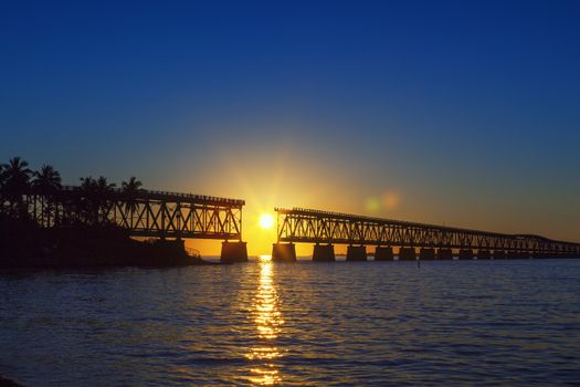 Beautiful colorful sunset or sunrise with broken bridge