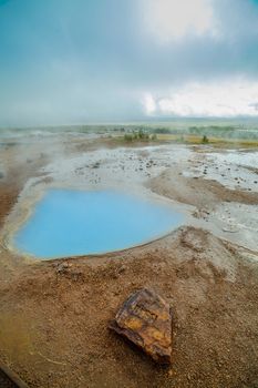 Geothermal activity with hot springs landscape, Iceland. Vertical view