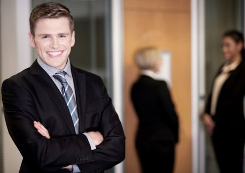 Friendly business people with male leader in front