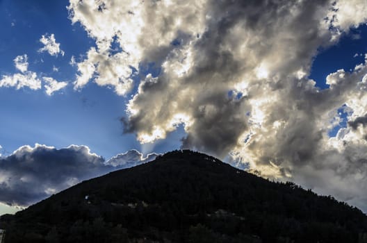 Dark hill in to the mountain in Spain, with beautiful sky background.