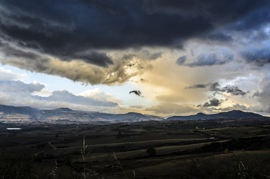 The beautiful valley of Navarra in Spain, with incredible cloudscape and sun light,