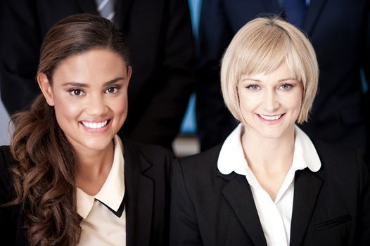 Beautiful business women posing together