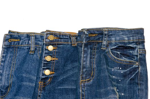 Stack of jeans isolated on white background.