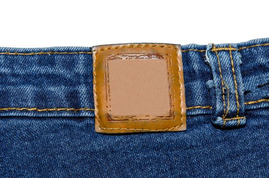 Label jeans are made of brown leather on white background.