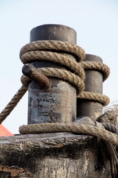 Detail of fairleads with ropes,Ropes at a commercial ship in port.