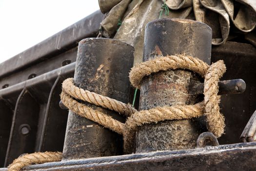 Detail of fairleads with ropes,Ropes at a commercial ship in port.