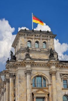 German parliament in Berlin. Left tower with flag.