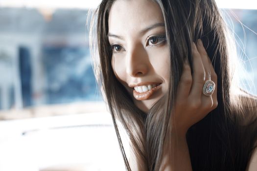 Elegant Asian lady with luxurious jewelry