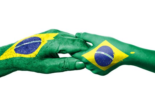 Two hands and Brazilian flag. Old and young hands