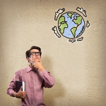 young man with a book thinks. it over symbol planet Earth