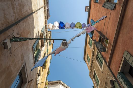 Cloth drying rope in quiet street of Venice, Italy.