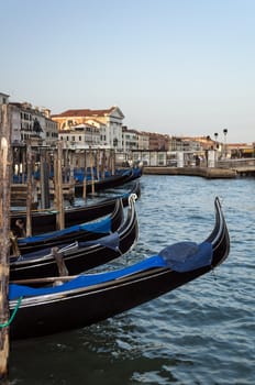 Gondolas in a canal in Venice, Italy.