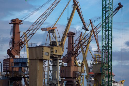 Composition of industrial massive cranes in the Shipyard in Gdansk, Poland.