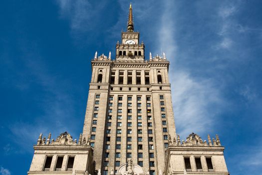 Palace of Culture and Science in Warsaw, Poland. The symbol of communism. Blue clear sky in the background