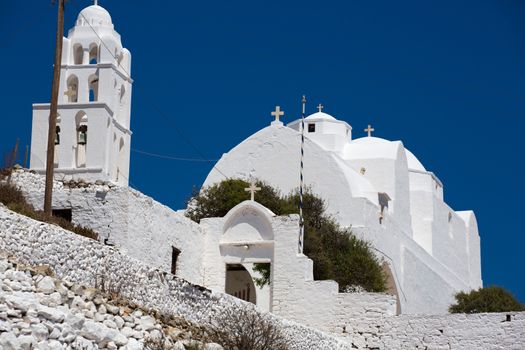 Close up from the facade and entrance of the  Gorgeous white orthodox church of Panagia of Chora, Island of Folegandros , Aegean sea. Greek 2013.
