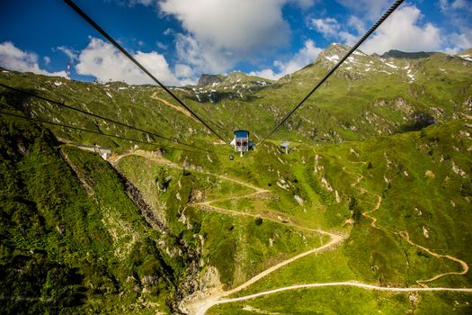 Modern chair lift in the high mountains