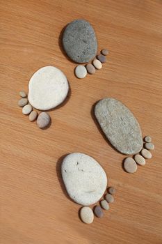 Smooth beach stones arranged to look like foot prints