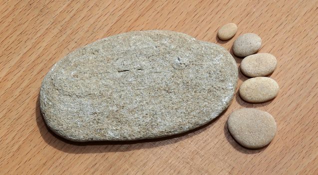 Smooth beach stones arranged to look like foot print