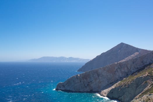 Beautiful view of the shoreline, the Aegean sea and the rocky mountains of Folegandros, an amazing island from Greece 2013.