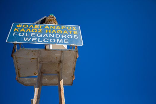 Boat sign: welcome in Folegandros at the port. and the deep blue sky, greece 2013.