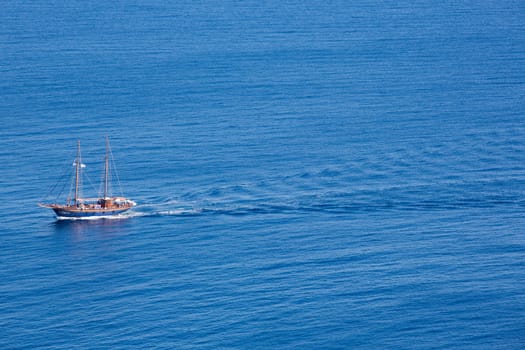 Little pleasure boat , filled with people on the calm aegean sea, greece 2013.