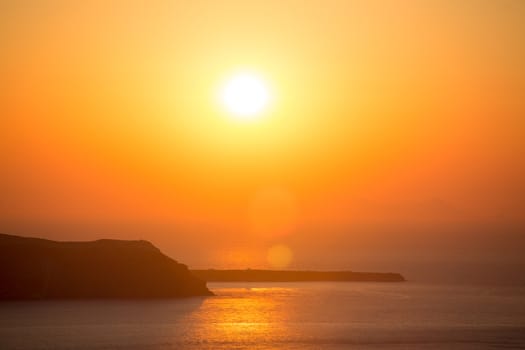 Beautiful sunset at the beach of Santorini in Greece, June, 25, 2013.