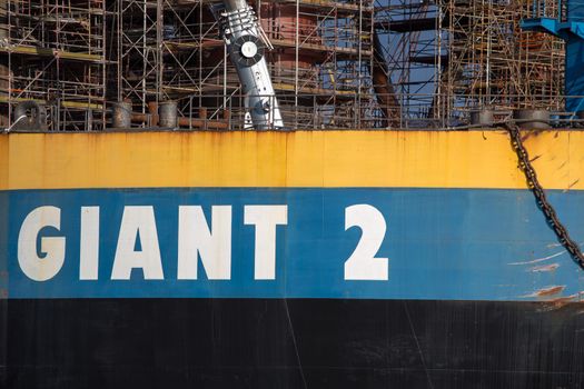 GDANSK, POLAND, SEPTEMBER 19: Docking oil rig at the Gdansk Shipyard under construction with a clear blue sky in the background. The oil rig weights 12 thousand tons. Gdansk, Poland, 2013