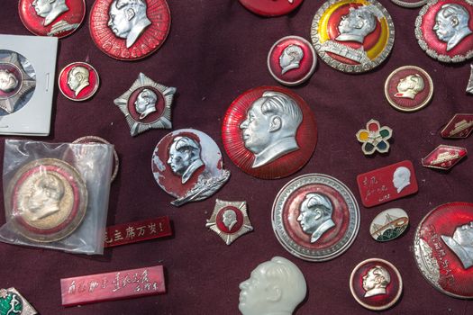 Various pins with the head of Mao taken in a vintage market in Shanghai, China 2013.