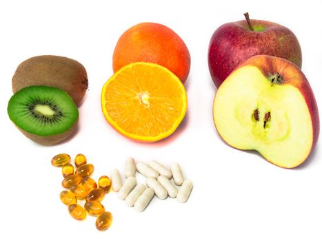 Various vitamin-rich fruits and vitamin tablets