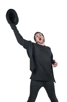 Young man in black with hat in hand yelling