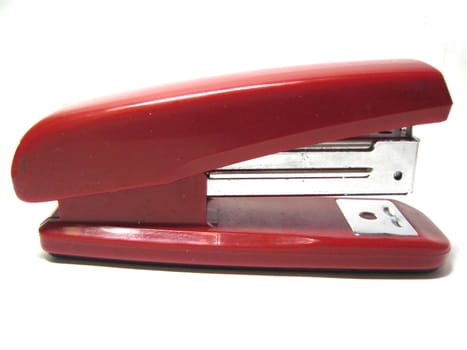 Red stapler isolated on the white background