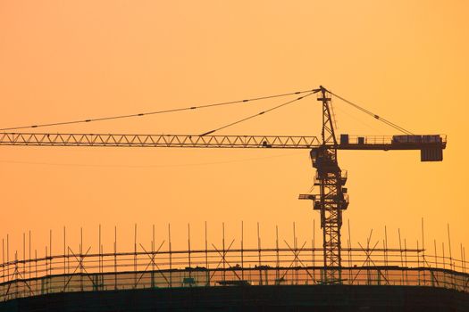 Sunset on a construction Site in Shanghai, the city is growing day after day with a population of over 20 millions people